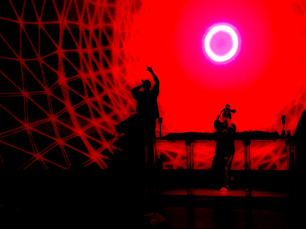 Throws the Devil Horns